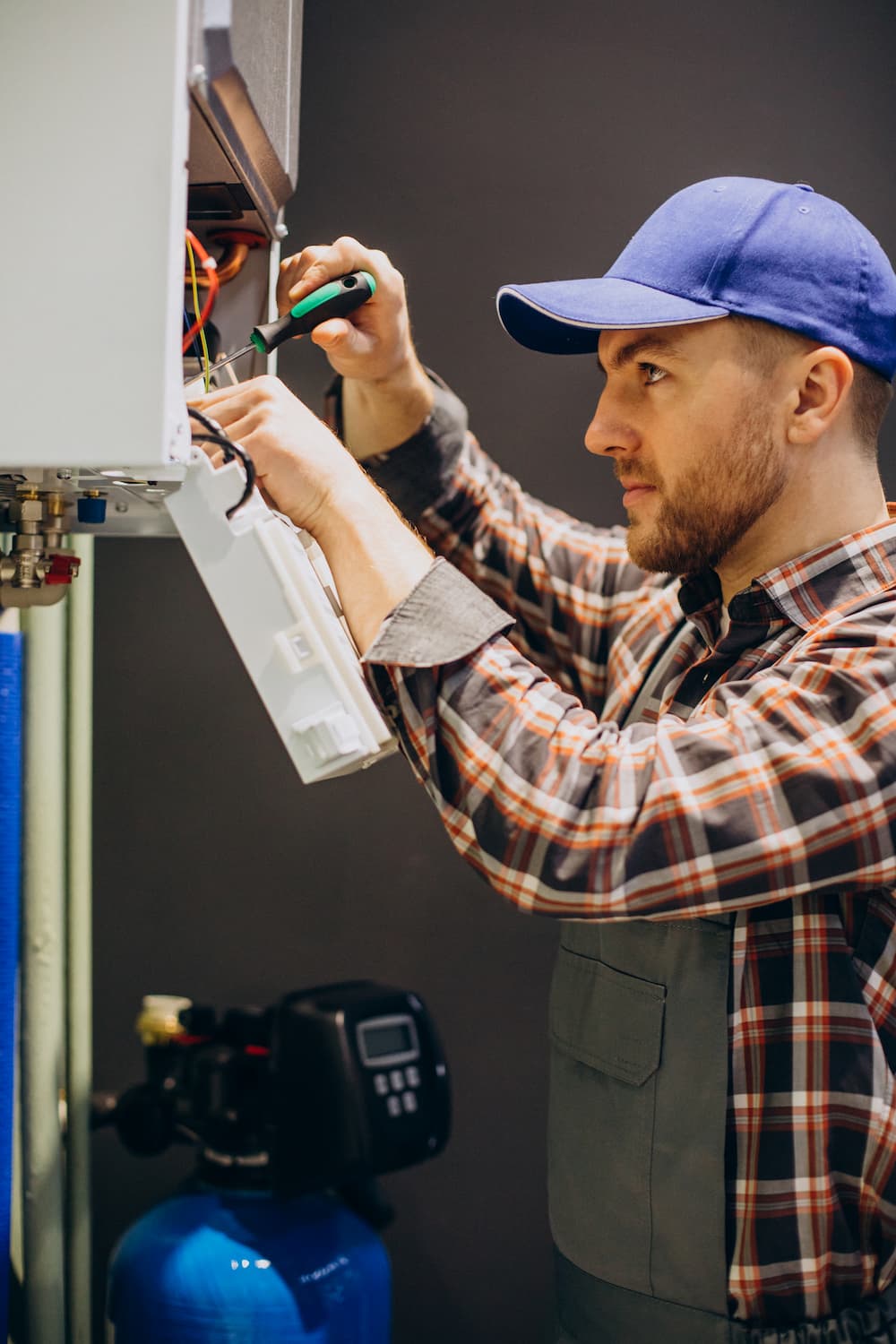 service-man-adjusting-house-heating-system (1)